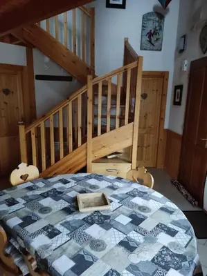 Un ou plusieurs lits dans un hébergement de l'établissement Le Chalet du Bucheron