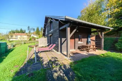 Jardin de l'établissement Appartement charmant à Vagney de 56 m² avec vue montagne.