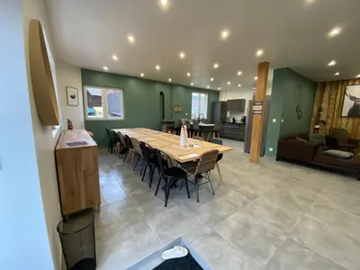Coin salon dans l'établissement Gîte 14 personnes - 10 minutes de Gerardmer - Jaccuzzi