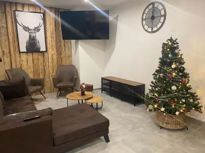 Coin salon dans l'établissement Gîte 14 personnes - 10 minutes de Gerardmer - Jaccuzzi