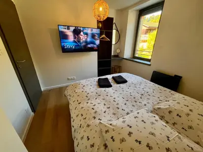 Un ou plusieurs lits dans un hébergement de l'établissement Superbe appartement neuf avec Sauna privé & Terrasse vue sur la montagne