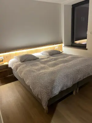 Un ou plusieurs lits dans un hébergement de l'établissement Superbe appartement neuf avec Sauna privé & Terrasse vue sur la montagne