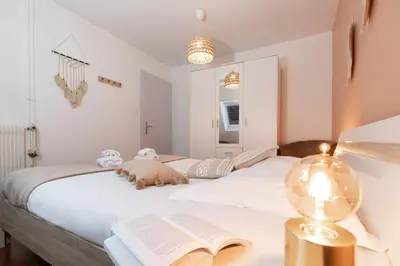 Un ou plusieurs lits dans un hébergement de l'établissement La Loge by 