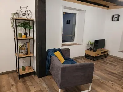 Coin salon dans l'établissement Cottage le Ni-La