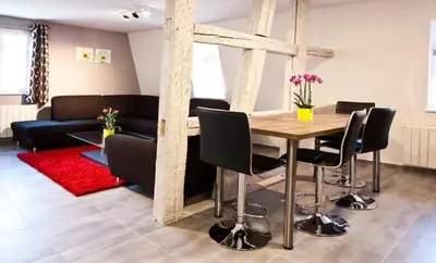 Coin salon dans l'établissement Appartements Le Hupsa Pfannala