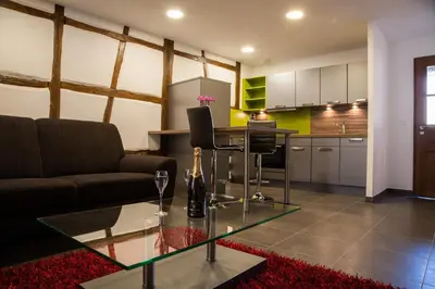 Cuisine ou kitchenette dans l'établissement Appartements Le Hupsa Pfannala