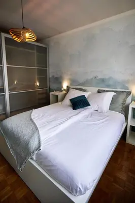 Un ou plusieurs lits dans un hébergement de l'établissement Maison 140m2 au calme - Beau jardin - à 15mn à pied du Centre-ville de COLMAR