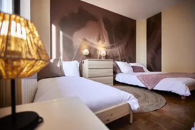Un ou plusieurs lits dans un hébergement de l'établissement Maison 140m2 au calme - Beau jardin - à 15mn à pied du Centre-ville de COLMAR