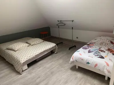 Un ou plusieurs lits dans un hébergement de l'établissement Appartement moderne