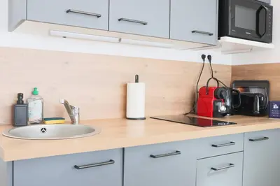 Cuisine ou kitchenette dans l'établissement {Le Factory}, proche EuroAirport