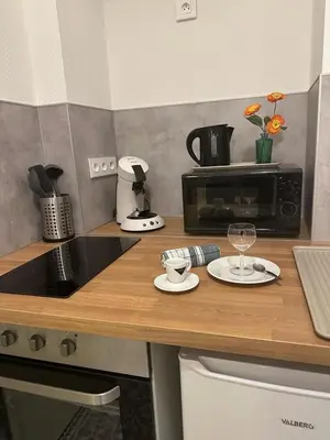 Cuisine ou kitchenette dans l'établissement Le Petit Café - Centre ville, parking gratuit