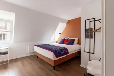 Un ou plusieurs lits dans un hébergement de l'établissement Travel Homes - Republic, charm in the heart of Colmar