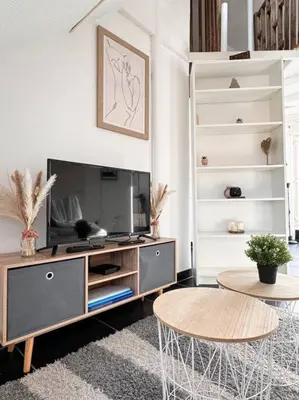 Télévision ou salle de divertissement dans l'établissement Le coin de Paradis, proche centre ville