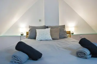Un ou plusieurs lits dans un hébergement de l'établissement Le coin de Paradis, proche centre ville