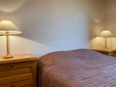 Un ou plusieurs lits dans un hébergement de l'établissement Chalet Miel