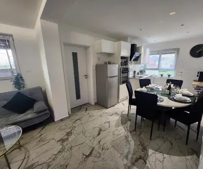Cuisine ou kitchenette dans l'établissement A O G prestige Relax Max SPA SAUNA