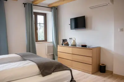 Un ou plusieurs lits dans un hébergement de l'établissement Chambre Super Broussard