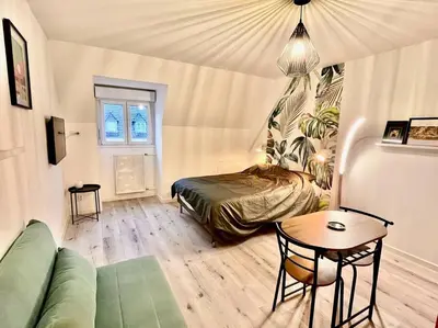 Un ou plusieurs lits dans un hébergement de l'établissement Charmant studio en vieille Ville de Belfort