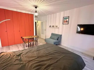 Un ou plusieurs lits dans un hébergement de l'établissement Charmant studio en vieille Ville de Belfort