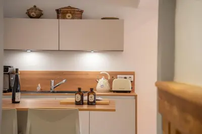 Cuisine ou kitchenette dans l'établissement Chambre Rose des Vents