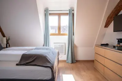 Un ou plusieurs lits dans un hébergement de l'établissement Chambre Pastis