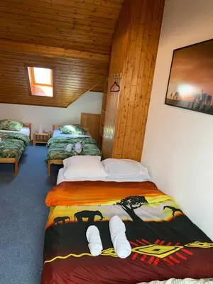 Un ou plusieurs lits dans un hébergement de l'établissement Appartement duplex
