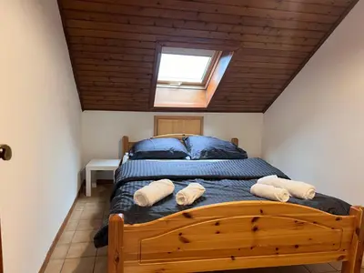 Un ou plusieurs lits dans un hébergement de l'établissement Appartement duplex