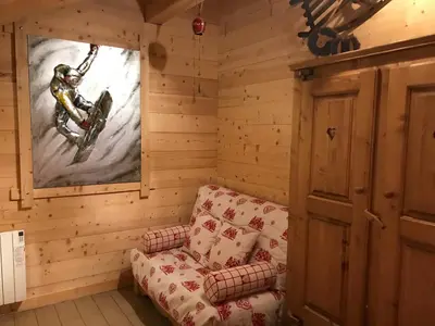 Coin salon dans l'établissement Chalet de la Royotte - Sauna & SPA
