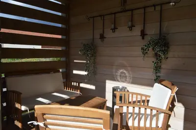 Coin salon dans l'établissement Chalet de la Royotte - Sauna & SPA