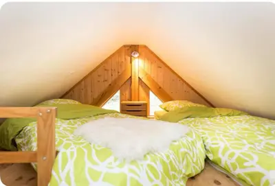 Un ou plusieurs lits dans un hébergement de l'établissement Gîte La Bergerie Chalet indépendant