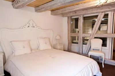 Un ou plusieurs lits dans un hébergement de l'établissement Chambre Le Hupsa Pfannala