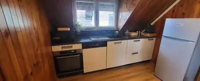 Cuisine ou kitchenette dans l'établissement Appart Bois de reve SPA