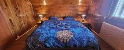 Un ou plusieurs lits dans un hébergement de l'établissement Appart Bois de reve SPA