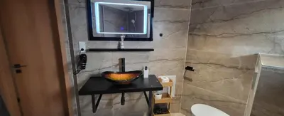Salle de bains dans l'établissement Appart Bois de reve SPA
