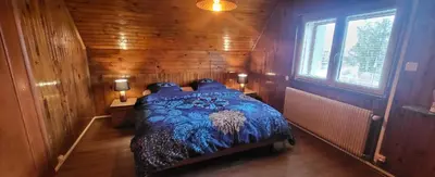 Un ou plusieurs lits dans un hébergement de l'établissement Appart Bois de reve SPA