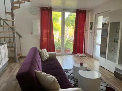 Coin salon dans l'établissement Maison « jardin la cigogne »