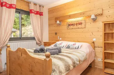 Un ou plusieurs lits dans un hébergement de l'établissement Chalet des 3 Vallées, spacious and comfortable 12p