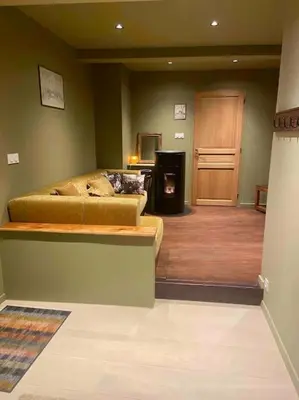 Coin salon dans l'établissement Suites du trèfle
