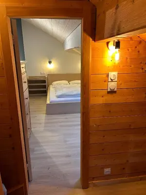 Un ou plusieurs lits dans un hébergement de l'établissement Joli Duplex sur la rive du lac