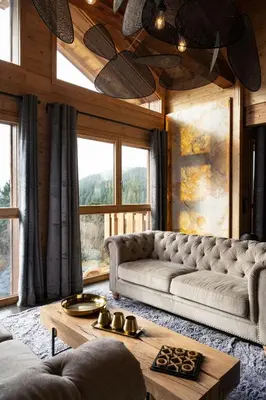 Coin salon dans l'établissement Chalet Emeraude, chalet de luxe avec vue montagne