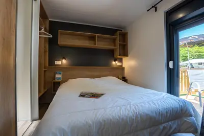 Un ou plusieurs lits dans un hébergement de l'établissement CAMPING KAYSERSBERG