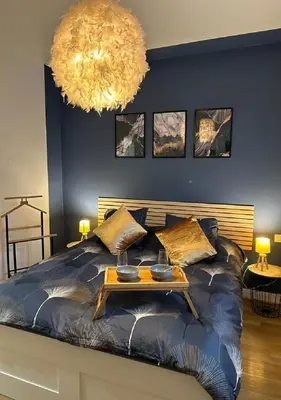 Un ou plusieurs lits dans un hébergement de l'établissement Charmant Cottage de village
