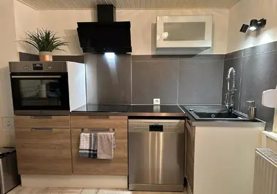 Cuisine ou kitchenette dans l'établissement Charmant Cottage de village