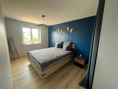 Un ou plusieurs lits dans un hébergement de l'établissement Charmant appartement Cosy porte de Colmar
