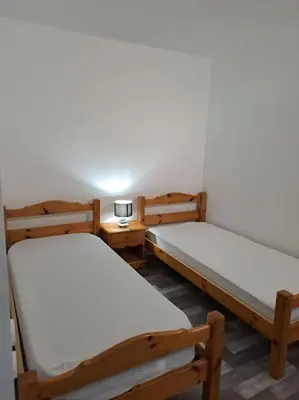 Un ou plusieurs lits dans un hébergement de l'établissement Appartement résidence Les Dryades avec vue montagne