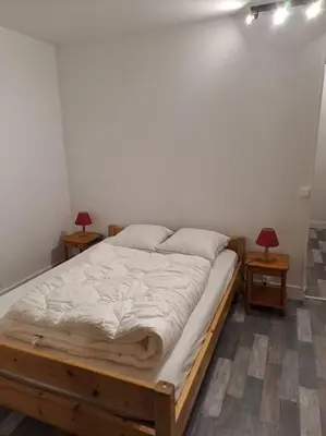 Un ou plusieurs lits dans un hébergement de l'établissement Appartement résidence Les Dryades avec vue montagne