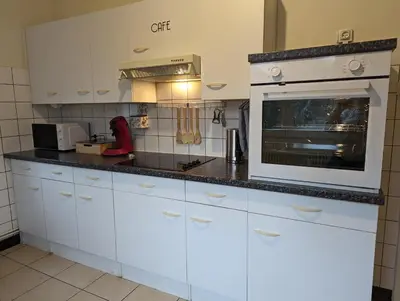 Cuisine ou kitchenette dans l'établissement Le Bâlois - appartement 2 chambres, salon, cuisine équipée, parking et wifi gratuit