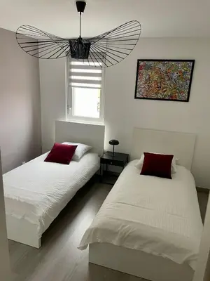 Un ou plusieurs lits dans un hébergement de l'établissement A few steps from BASEL with Balcony and free private Parking
