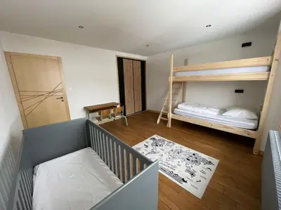 Un ou plusieurs lits dans un hébergement de l'établissement Appartement lumineux avec balcon