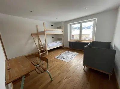 Un ou plusieurs lits dans un hébergement de l'établissement Appartement lumineux avec balcon